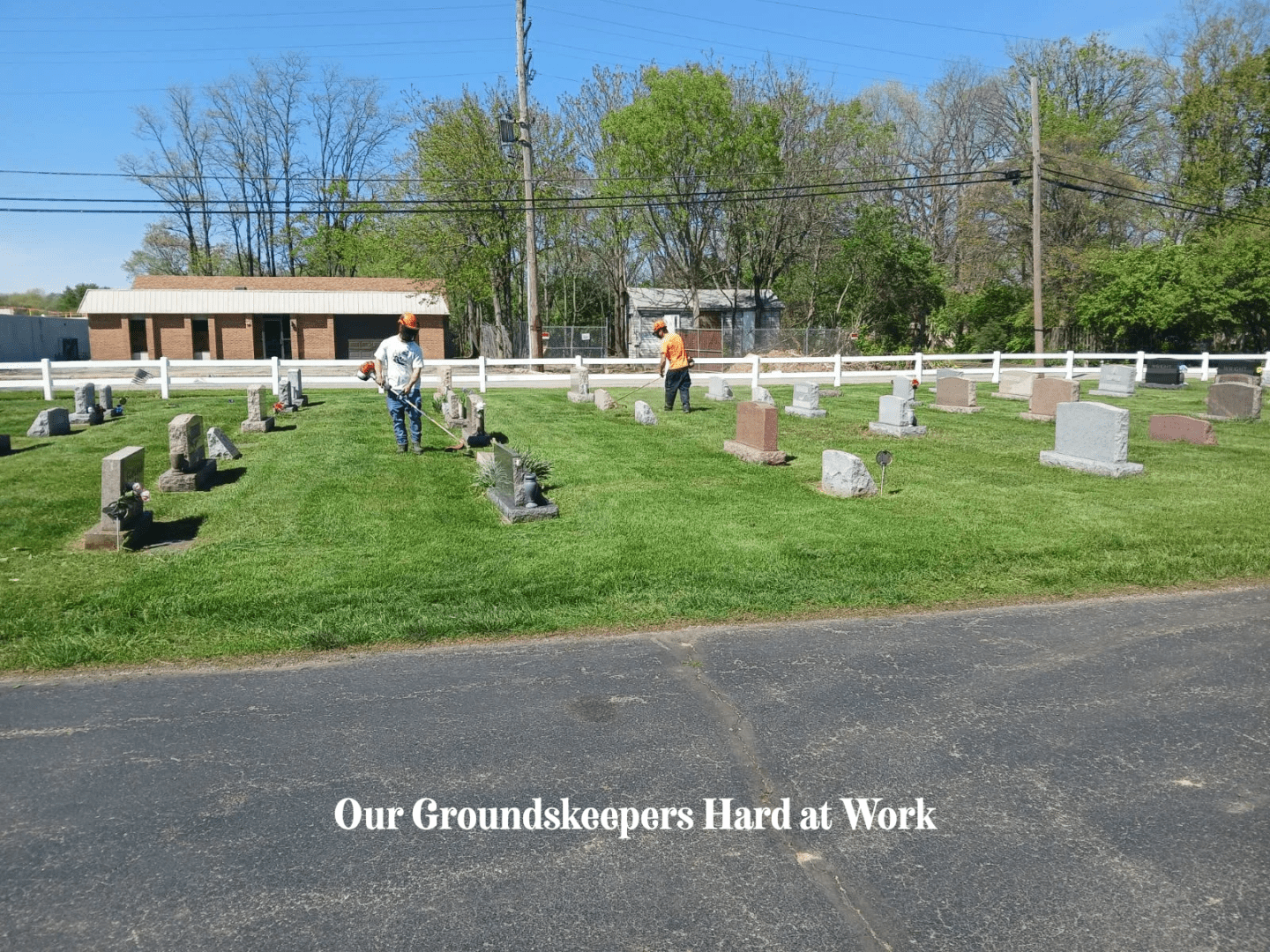 A cemetery with people walking around it.