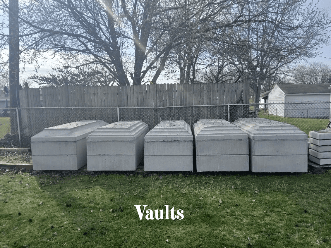 A group of mattresses in the grass.